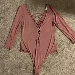 Pink bodysuit, tie cutout front and back